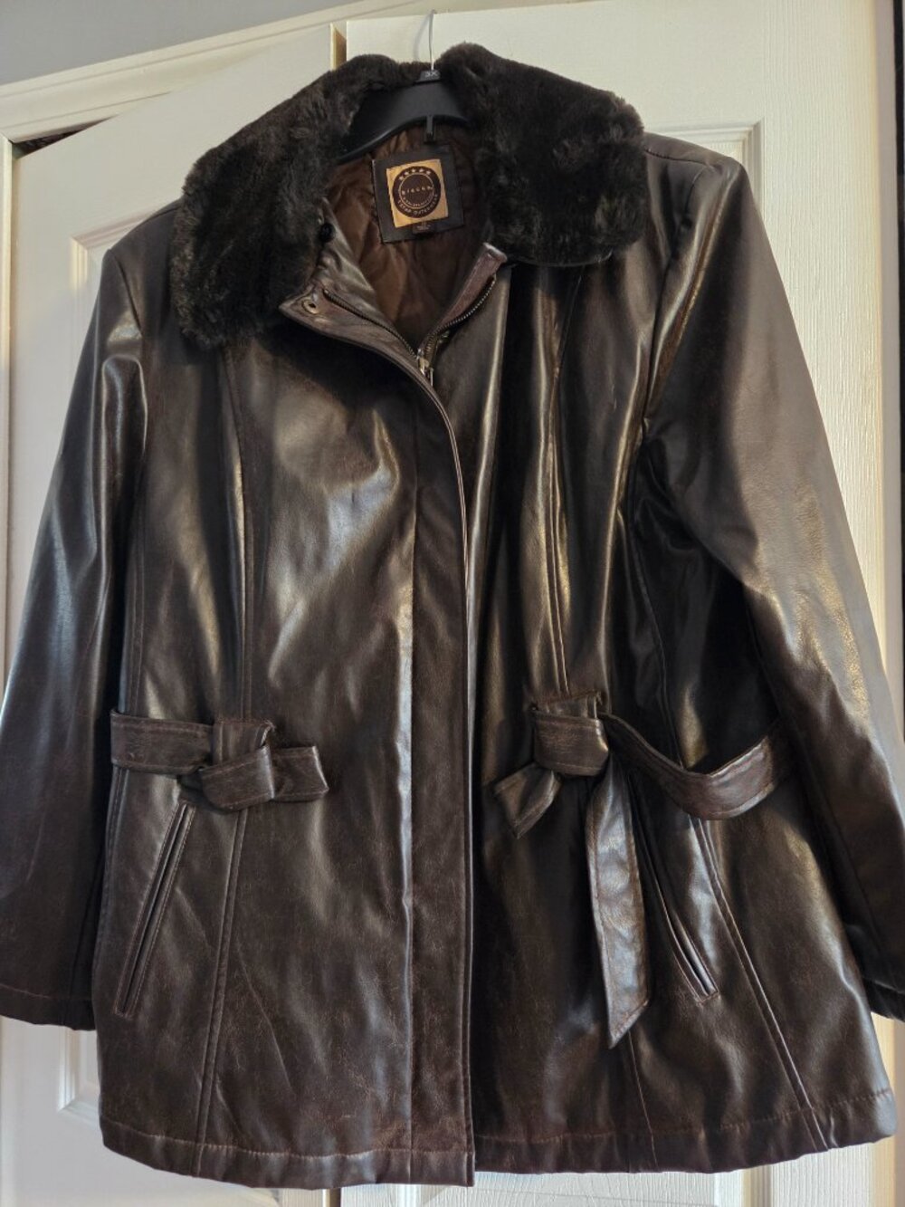 Faux leather coat with fur collar.